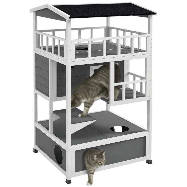 Light gray wooden cat house with asphalt-style roof, escape door, and stacked platforms