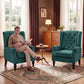 Dark green wingback accent chair with button-tufted back, round arms, and wooden legs