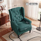 Dark green upholstered lounge chair with wingback sides, button-tufting, and turned legs