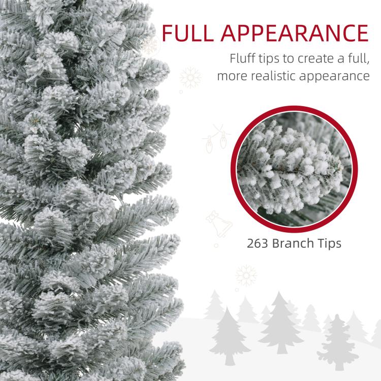 Snow-frosted branch tips on an artificial pencil Christmas tree