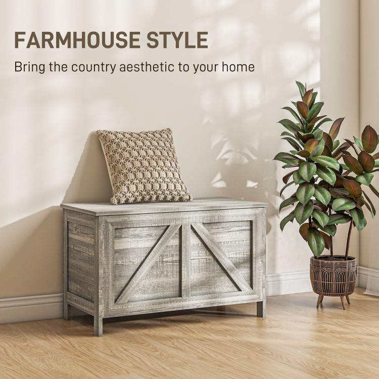 Gray farmhouse storage chest with lift top and cross-panel front, square legs