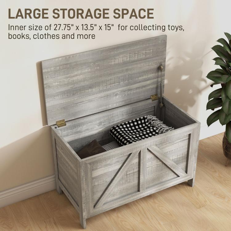 Gray storage chest with lift top open, roomy interior and cross-panel front