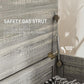 Gray safety gas strut hinge for lift-top lid on storage chest