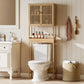 Bamboo over-toilet storage cabinet with slatted doors and tiered open shelf space