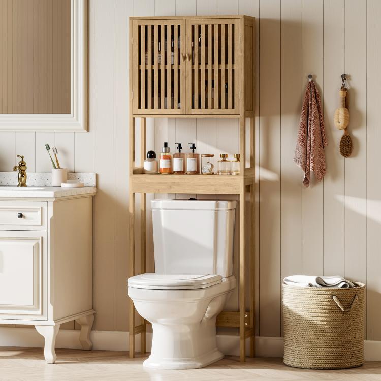 Bamboo over-toilet storage cabinet with slatted doors and tiered open shelf space