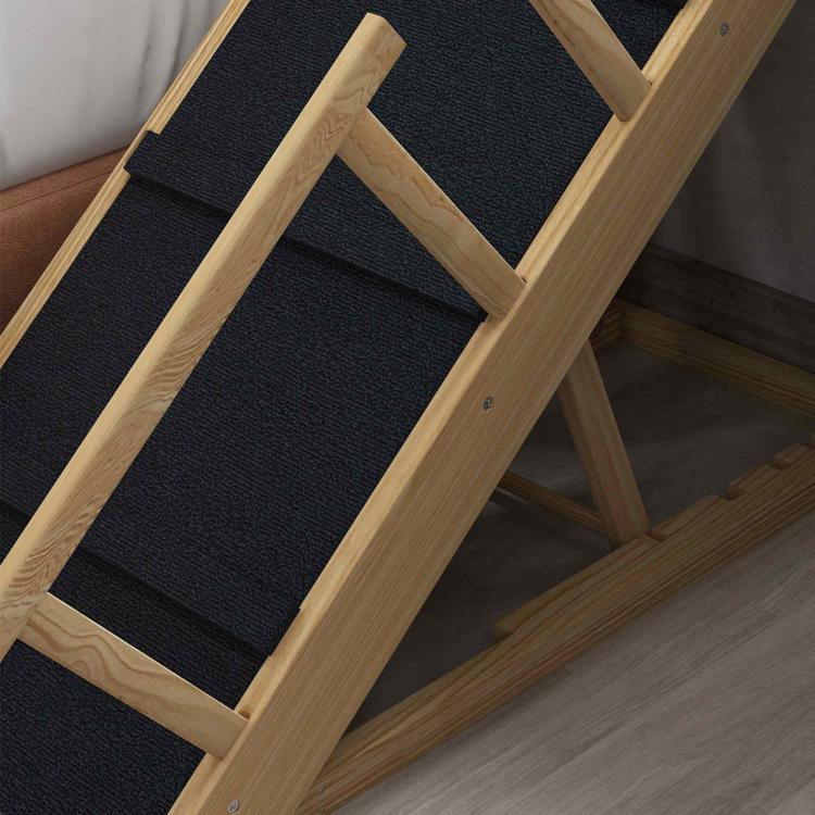 Wooden adjustable dog ramp with black non-slip step pads, close-up