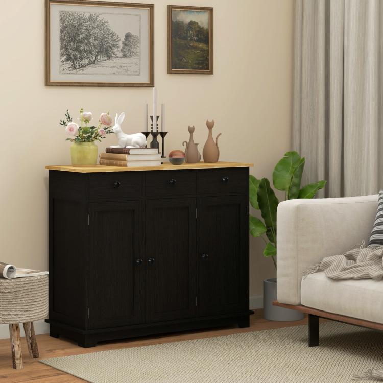 Black kitchen storage cabinet with light wood top, paneled double doors, and metal knobs
