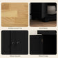 Black cabinet hardware and light wood top close-up: metal handle and hinge