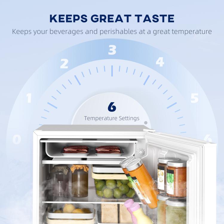 White mini fridge door open, freezer shelf and interior bins with produce and jars