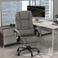 Gray high-back reclining office massage chair with padded arms and adjustable footrest