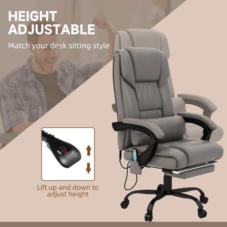 Gray massage office chair with adjustable height lever and reclining footrest