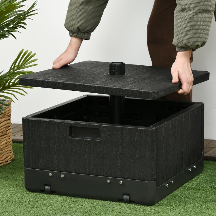 Black outdoor umbrella base table with open storage compartment and center pole holder