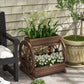 Brown wooden 3-tier wagon planter box with wheel accents and floral plants