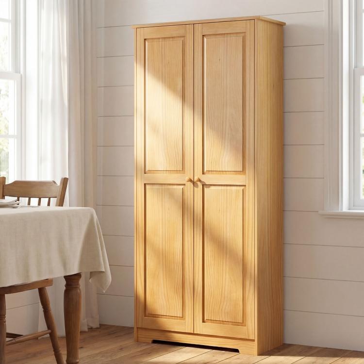 Light wood freestanding kitchen pantry cabinet with two paneled doors
