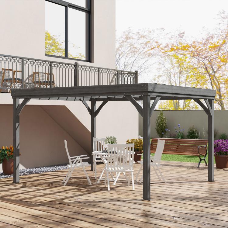 Gray pergola frame on a wooden deck with slatted roof and arched corner braces.