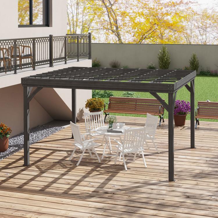 Gray wooden pergola with slatted roof over patio deck with benches and planters.