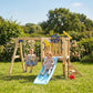 Kids playing on wooden swing set with blue slide and hanging rope swing