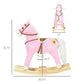 Pink plush rocking horse ride-on with wooden base and star detail on side