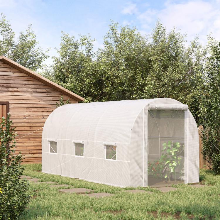 White tunnel greenhouse with front roll-up door and screened side walls