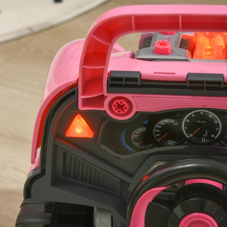 Pink kids mechanic toy truck with open hood, engine parts and glowing dashboard lights