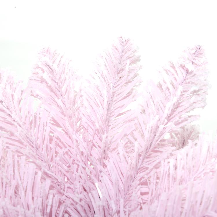 Pink pencil Christmas tree with snow-flocked branches, fluffy close-up