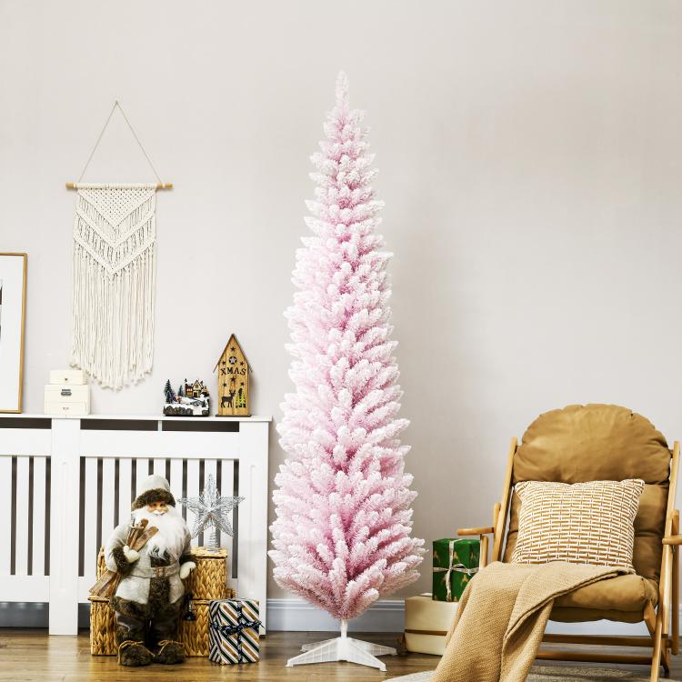 Pink snow-flocked pencil Christmas tree with tiered branches on a white stand