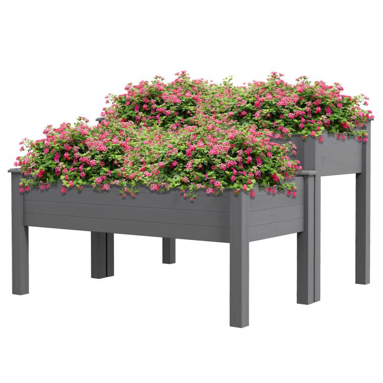 Gray two-tier raised garden bed planter filled with dense pink and green flowers