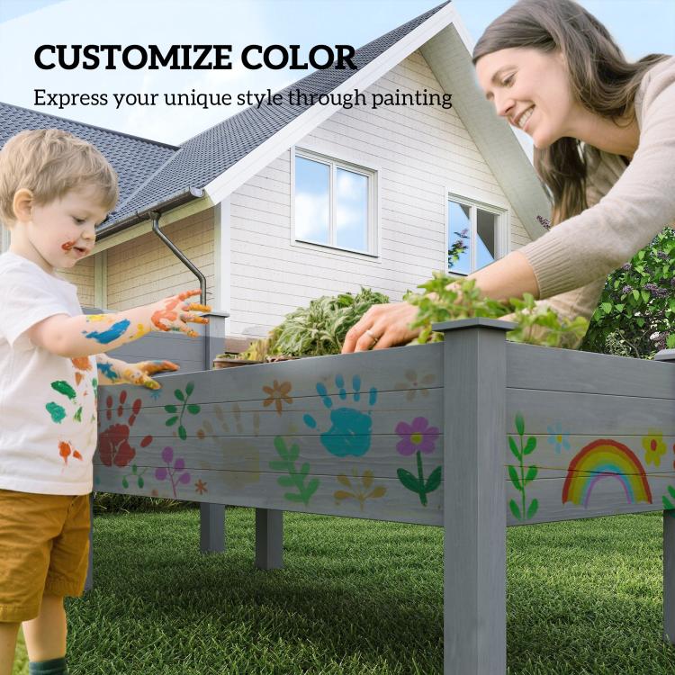 Gray two-tier raised garden bed planter painted on the front while a child watches