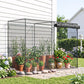 Black plant protection crop cage with netting over potted flowers on a patio