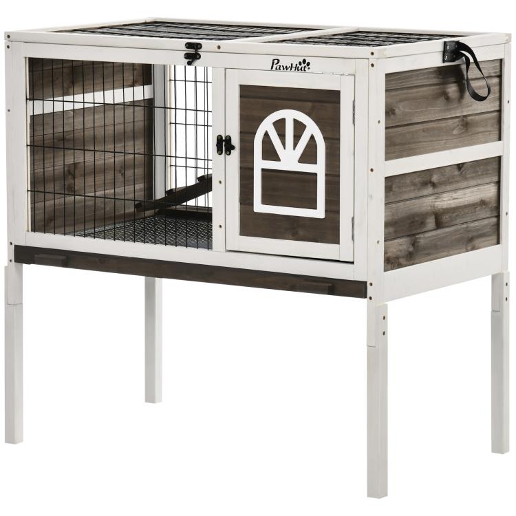 Elevated rabbit hutch with wire side gate, front door, and dark interior ramp