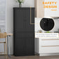 Black pantry cabinet with double doors and two drawers plus anti-tip wall strap