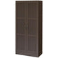 Dark brown storage cabinet with double doors, inset panels, and silver bar handles