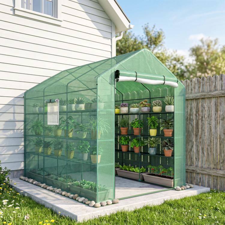Green mesh temporary greenhouse with open zip door and plant shelf interior