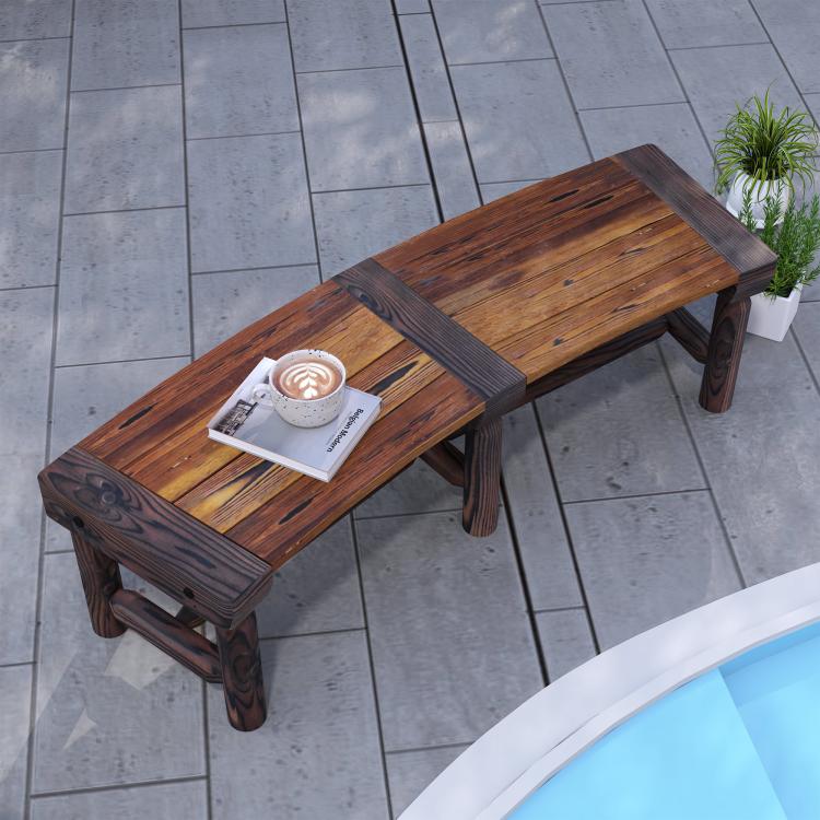 Wooden outdoor tree bench with dark brown slatted seat on a tiled patio
