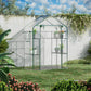 Outdoor walk-in mini greenhouse with green frame and mesh sides, placed in a garden