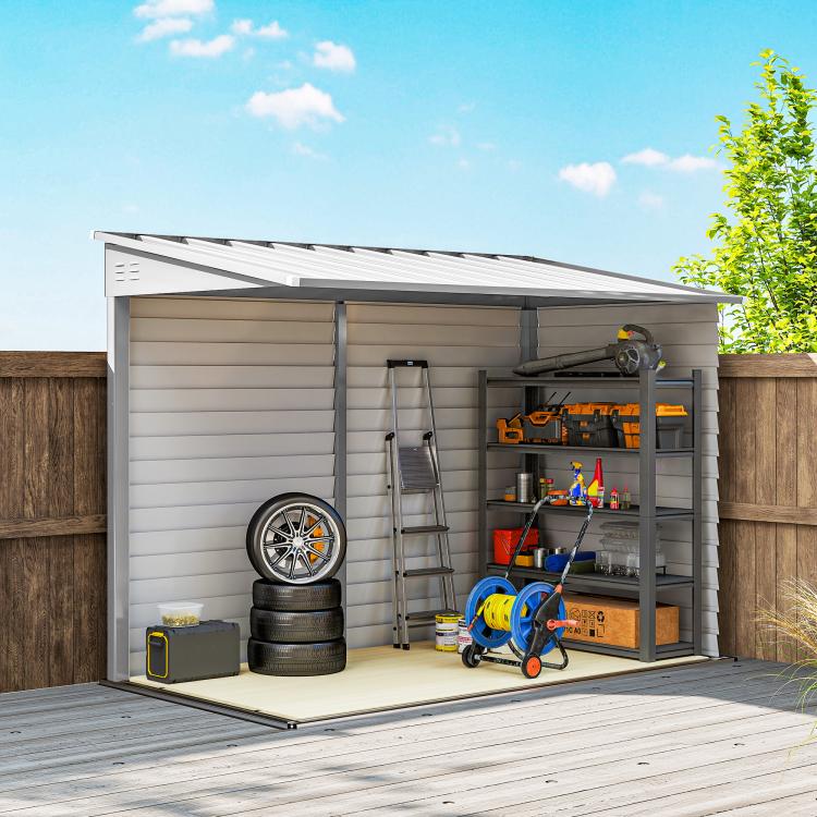 White metal outdoor storage shed, open double doors with interior shelving