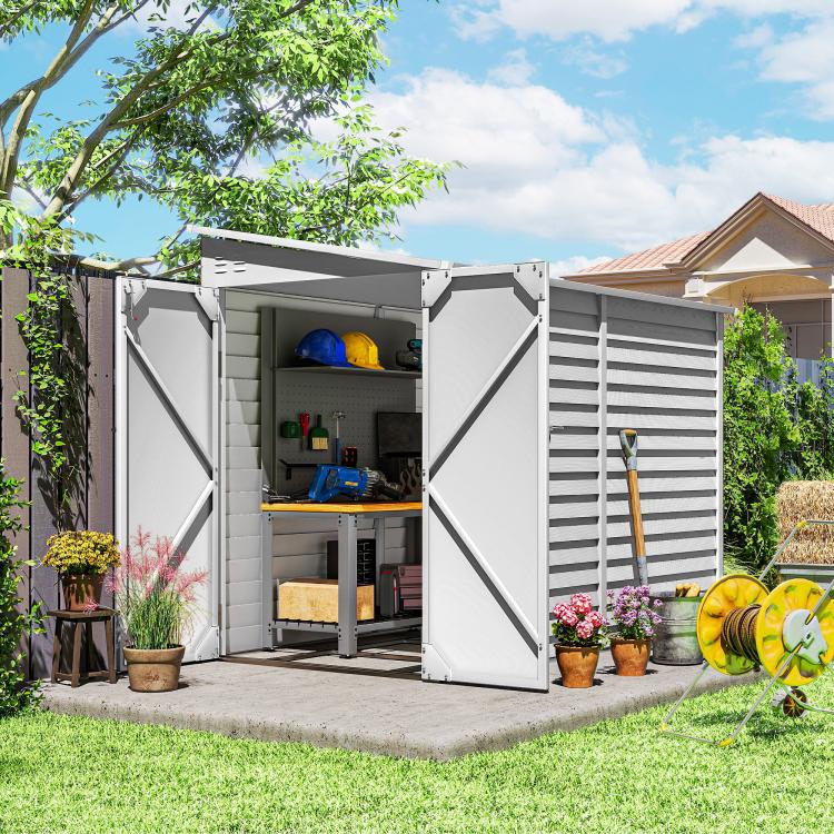 Outdoor metal storage shed with both doors open and side louver panels