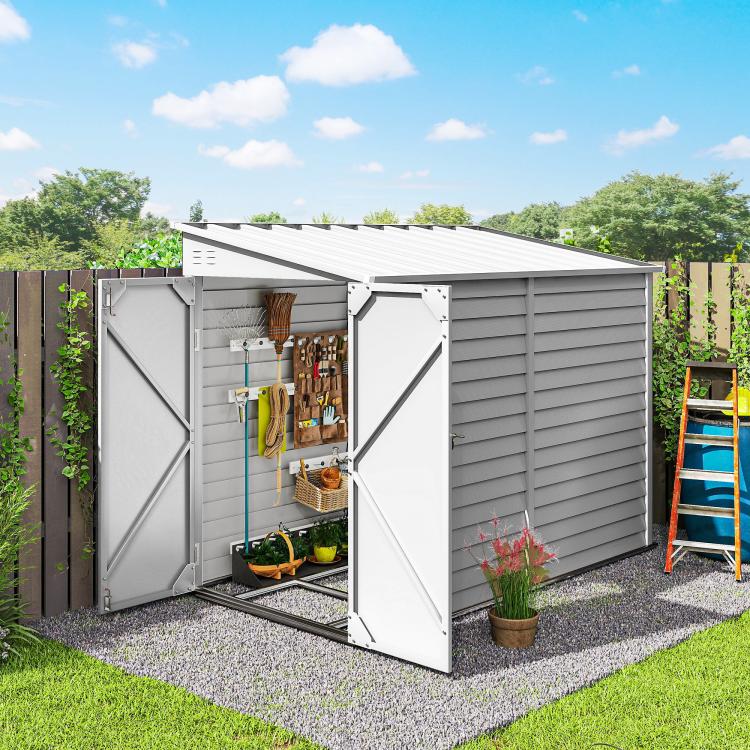 White metal outdoor storage shed with double doors closed and louvered side wall