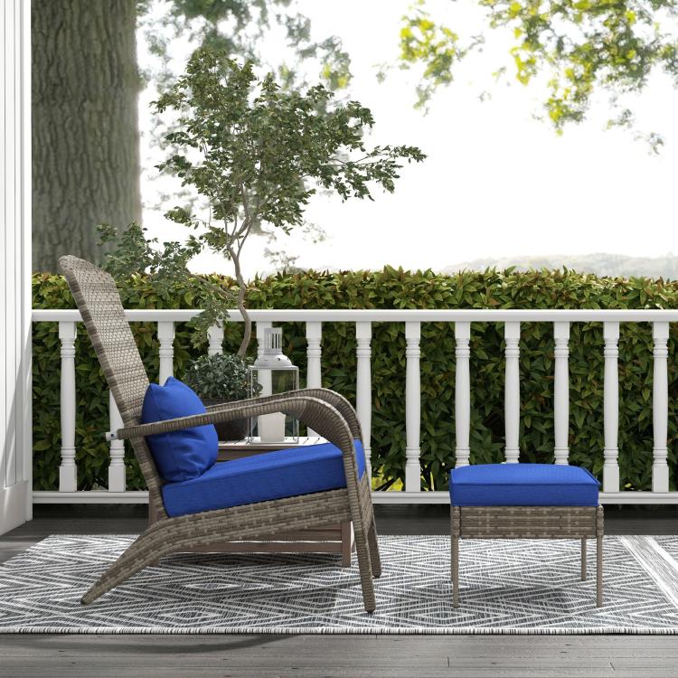 Wicker lounge chair and ottoman with blue cushions on outdoor deck