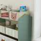 Green toy organizer with side panel and animal print fabric bins on shelves