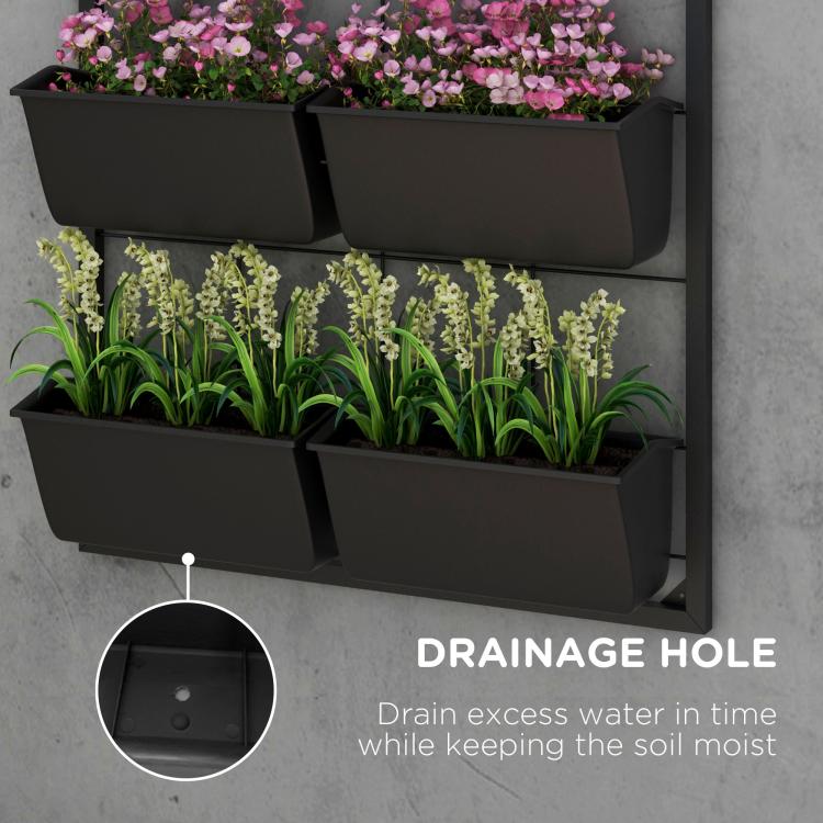 Black planter pots with drainage hole detail on a 3-tier wall system