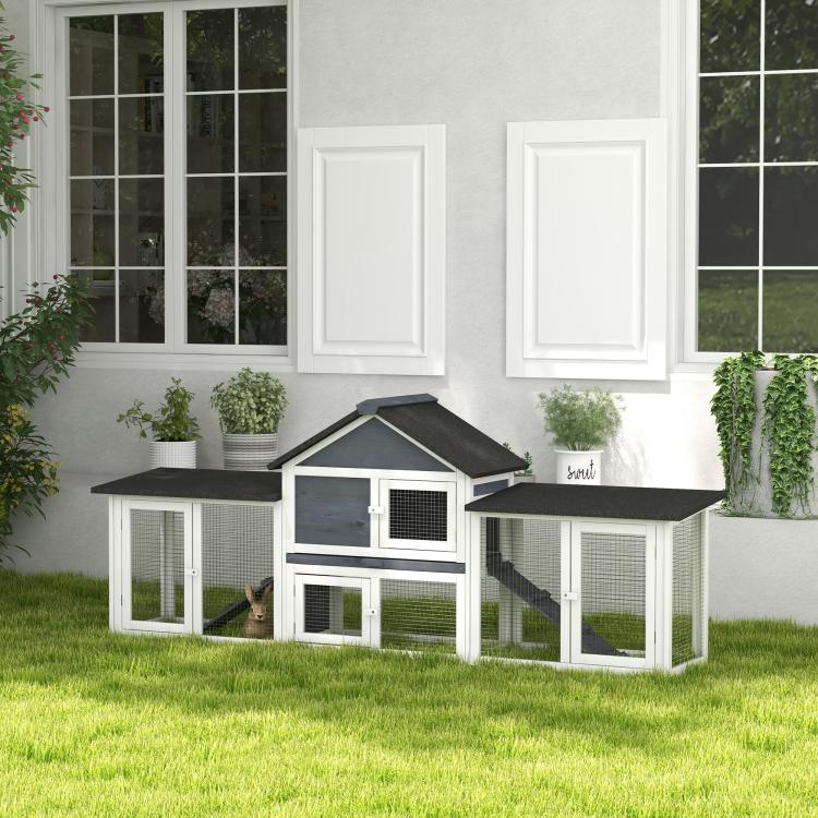 Dark gray roof two-story rabbit hutch with front door, wire panels, and side run