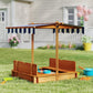 Wooden kids sandbox with striped canopy top and open front seating area