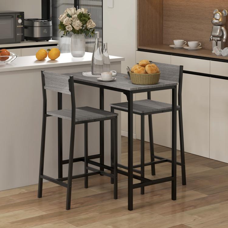 Gray counter-height bar table with two bar stools, slatted backs and square frames.