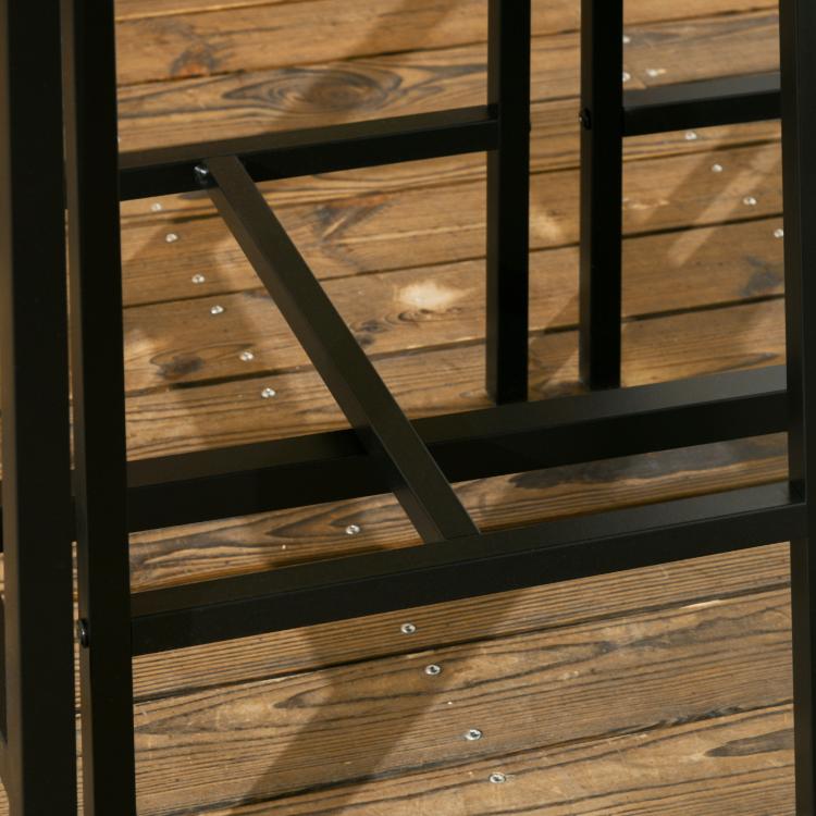 Close-up of dark metal bar table support beams and cross bracing beneath tabletop.