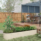 Cream raised garden bed planter with ridged sides, holding green plants in a backyard setting