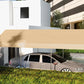 Beige carport canopy cover over sedan with open sides and dark roof underside