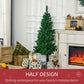 Artificial half Christmas tree with holiday decorations beside fireplace mantle
