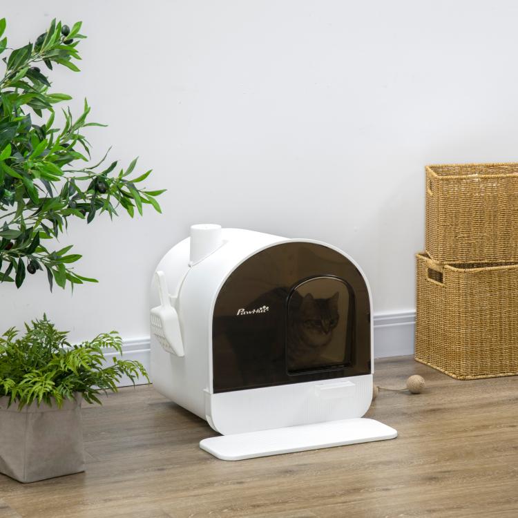 White enclosed cat litter box with brown door opening and raised front tray, no cat visible