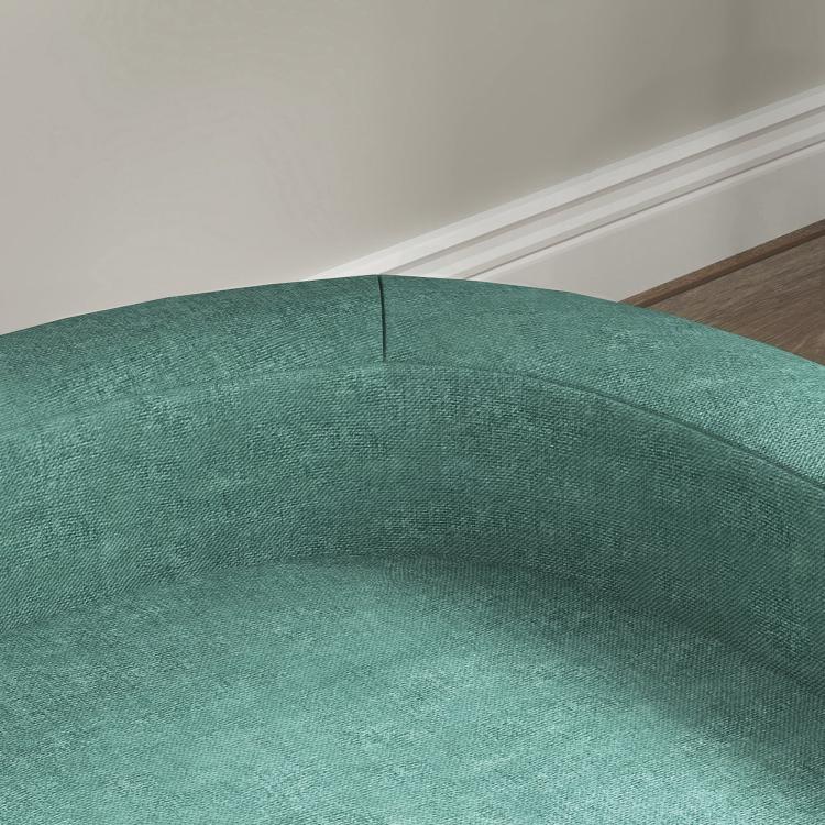 Green pet sofa bed cushion with visible seam and textured fabric